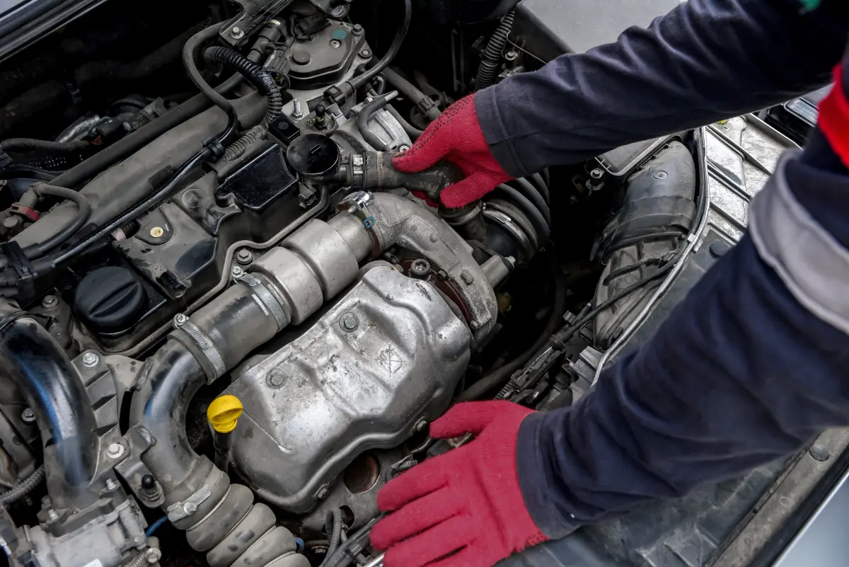 A technician assembling a remanufactured engine